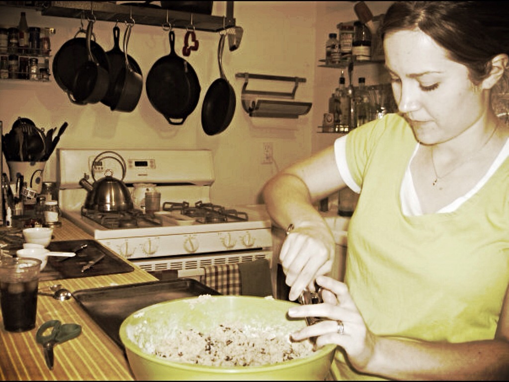 {making cookies in our unfinished kitchen..2x4 lumber and plywood countertops covered in dollar store plastic tablecloths} 