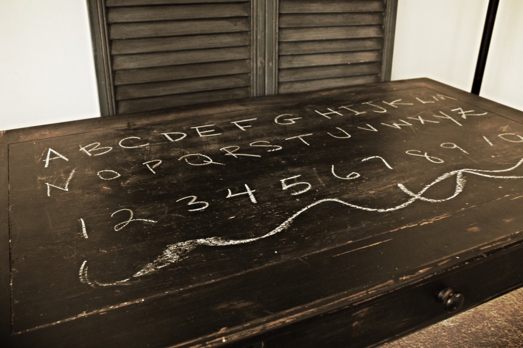 {a few coats of black spray paint to a hand-me-down pine coffee table make a perfect chalk and coloring table for a certain 2-year-old little boy}